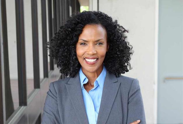 Image of a confident African American woman in business attire