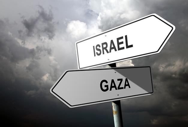 Image of road signs pointing to Israel and Gaza