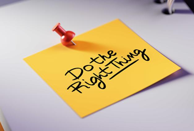 Image of a yellow post-it note on a blank notebook page that reads "Do the right thing"
