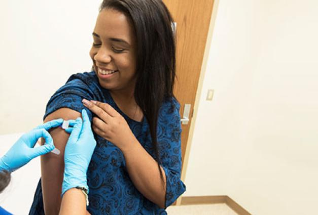 Woman receives COVID vaccine
