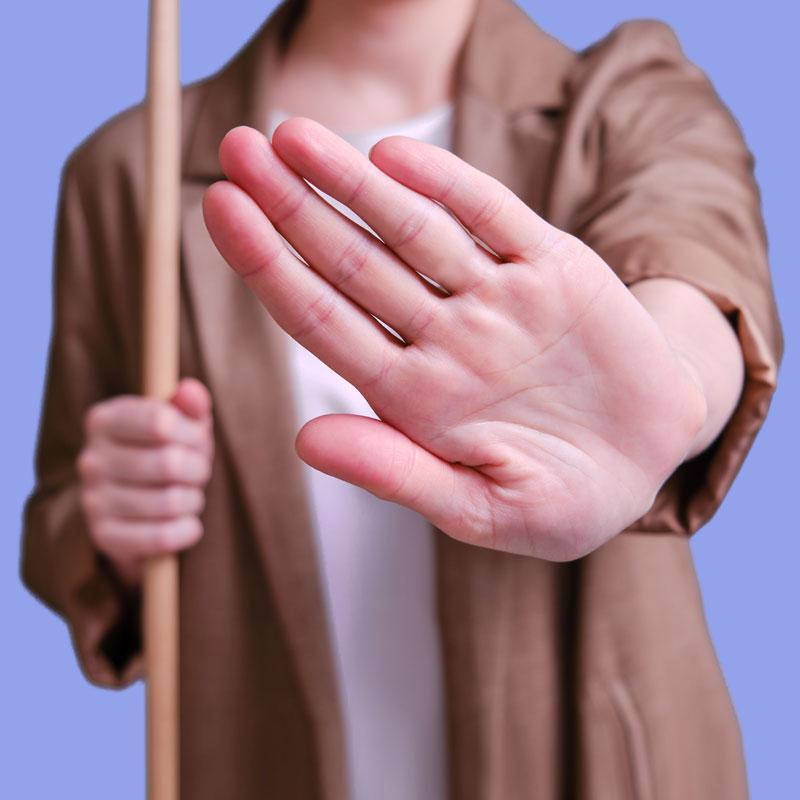 Woman displaying a hand gesture of refusal