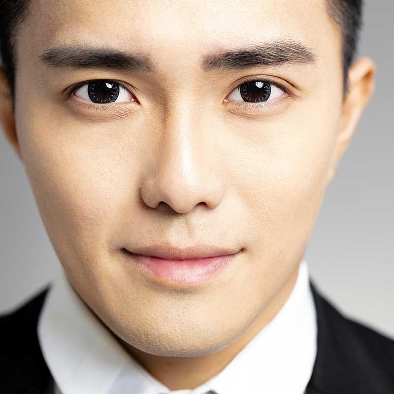 Young Asian man with dark eyes 
