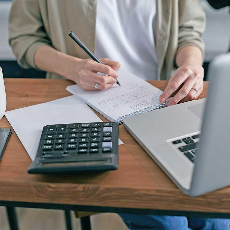 Woman doing financial work on laptop