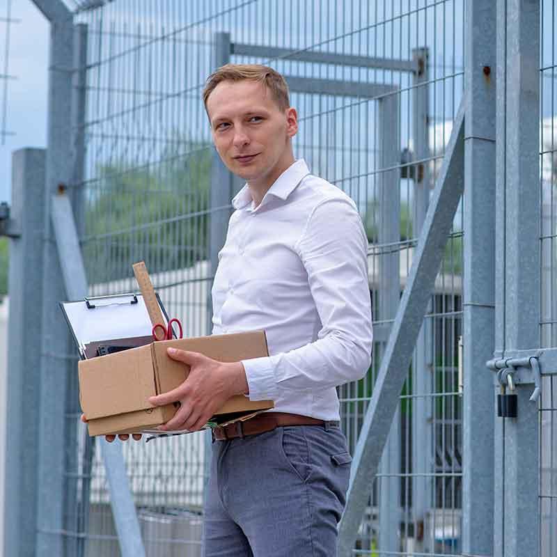 White Male prisoner holding box