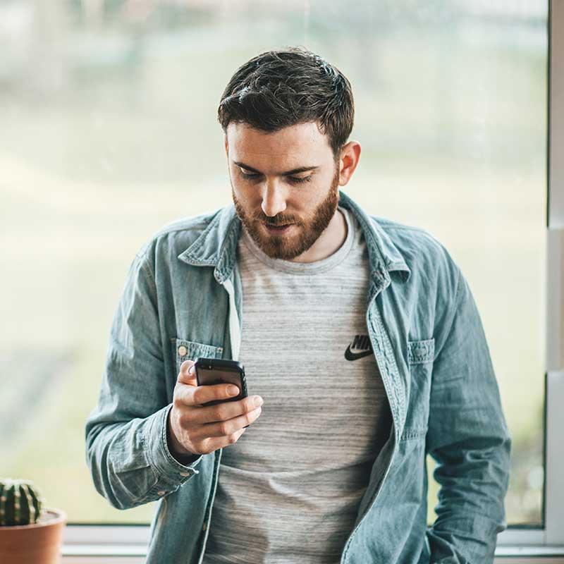 Man looking at mobile device