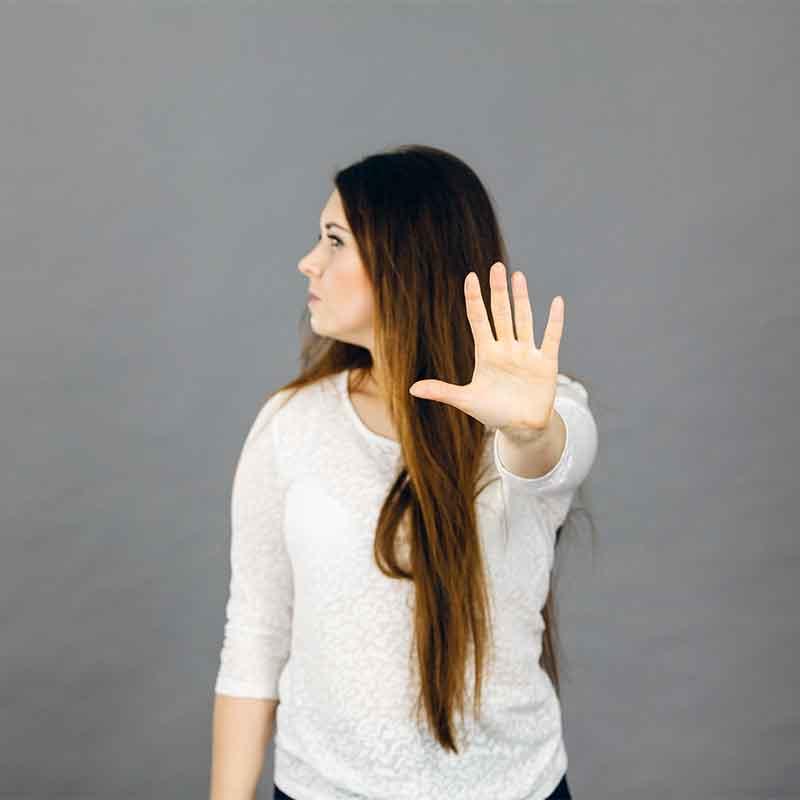 Woman saying no with hand