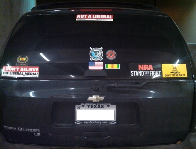 Image of truck with political bumper stickers