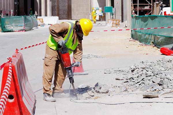 Image of construction worker using a jackhammer