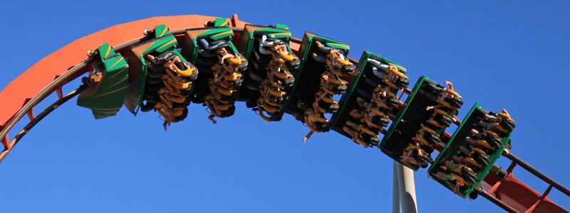 Image of people riding a rollercoaster as it twists sideways and upside down