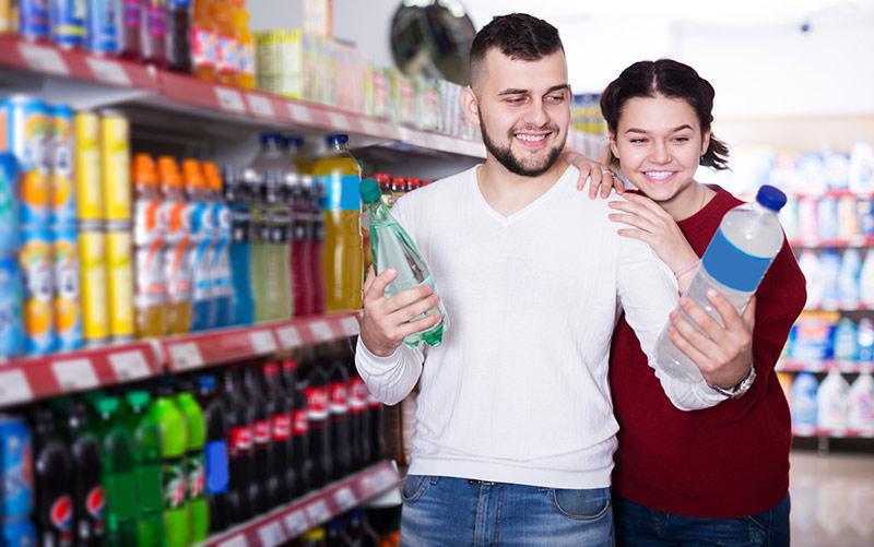 Image of man and woman debating healthy beverage choices